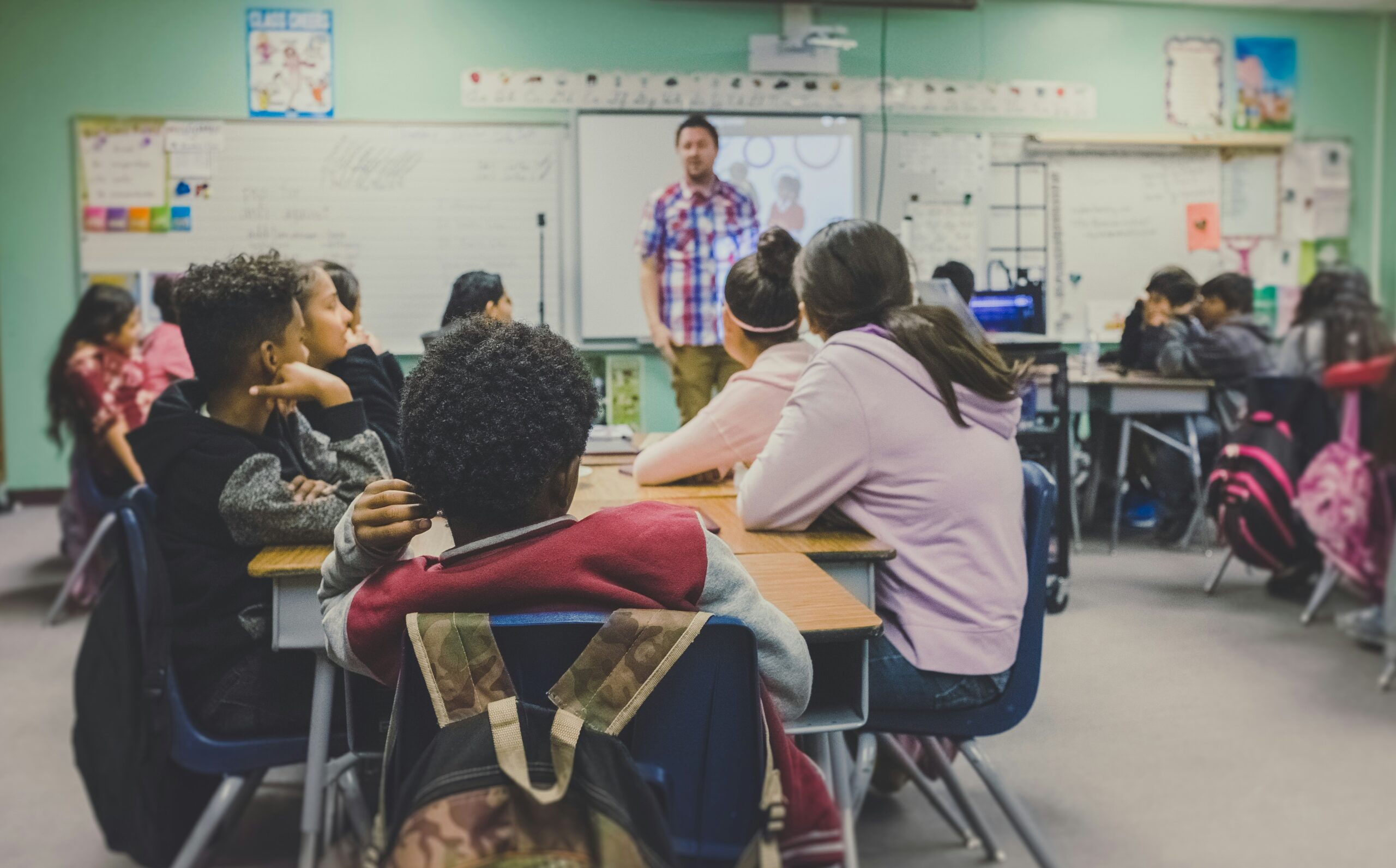 Teacher using laptop to explore education technology grants for schools 2026